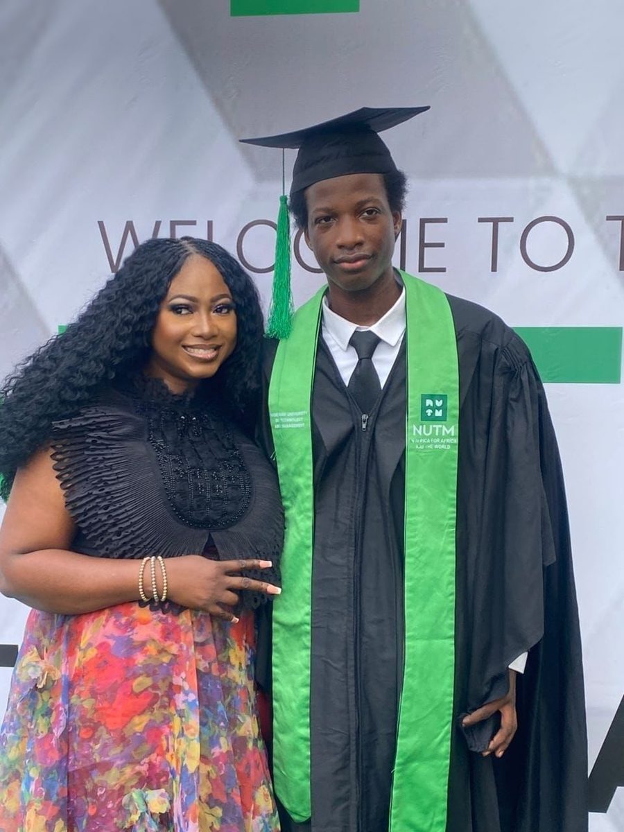 A proud parent with her son at his university graduation